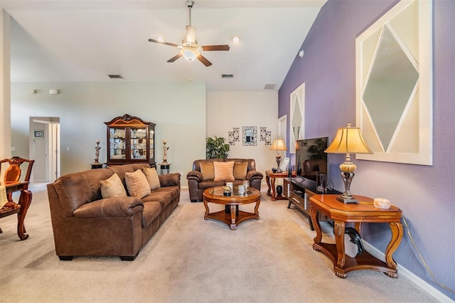 carpeted living room featuring lofted ceiling and ceiling fan