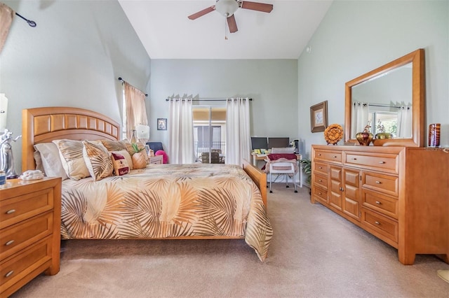 carpeted bedroom with lofted ceiling and ceiling fan