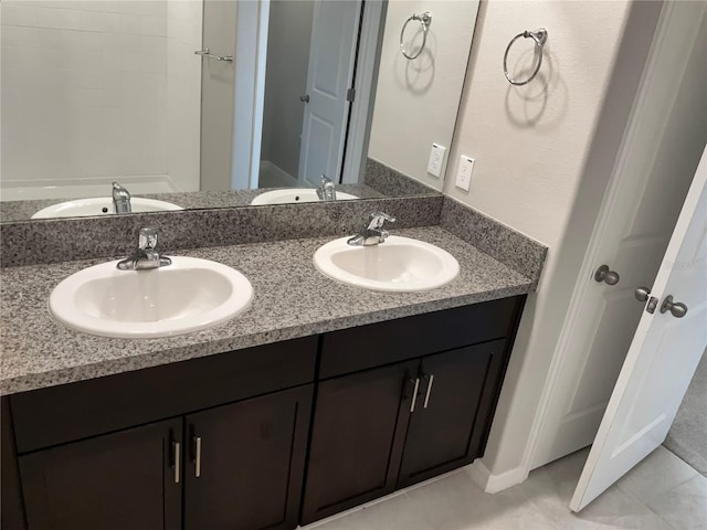 bathroom featuring tile patterned flooring and vanity