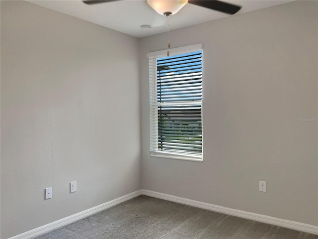 unfurnished room with a healthy amount of sunlight, ceiling fan, and carpet flooring