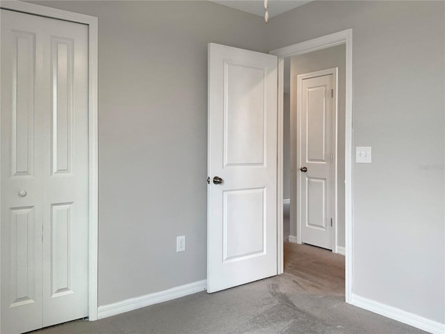 unfurnished bedroom with light colored carpet