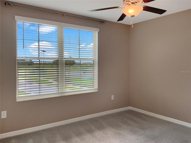 carpeted empty room with ceiling fan