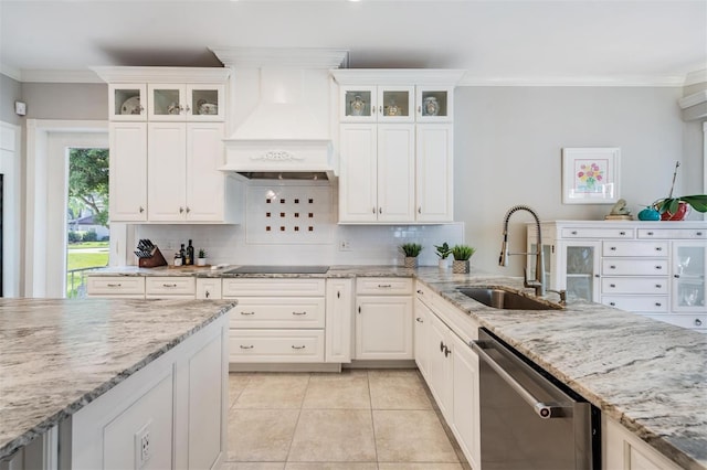 kitchen with sink, tasteful backsplash, white cabinetry, dishwasher, and custom range hood