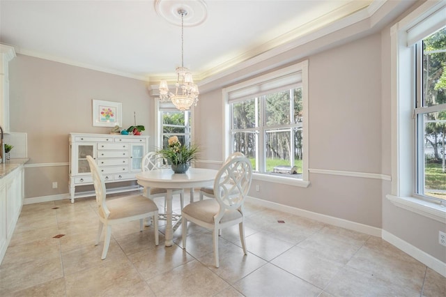 tiled dining space with crown molding and an inviting chandelier