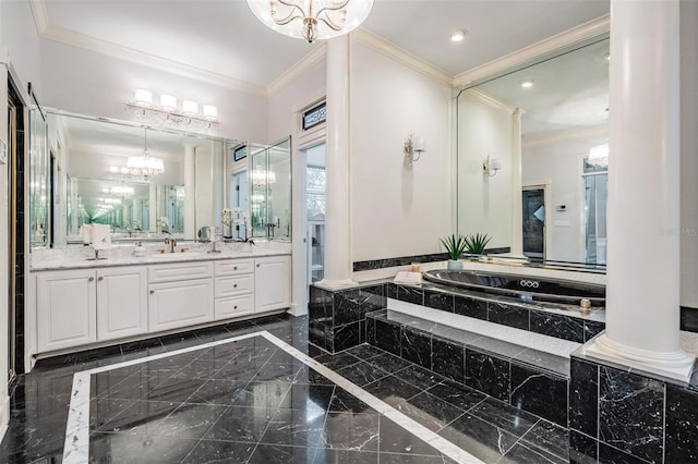 bathroom featuring a relaxing tiled tub, vanity, decorative columns, and ornamental molding