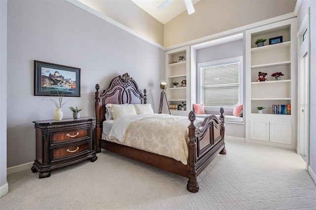 bedroom featuring lofted ceiling, ceiling fan, and light carpet