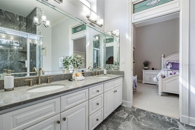 bathroom with vanity, ornamental molding, and a shower with door