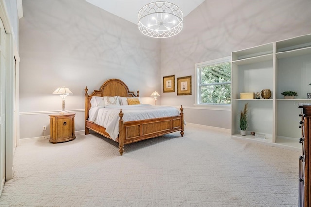 carpeted bedroom featuring a closet and a towering ceiling