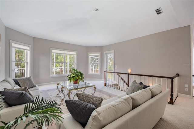 carpeted living room featuring a healthy amount of sunlight