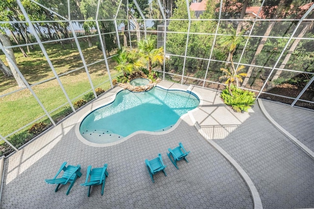 view of pool featuring a lanai and a patio area