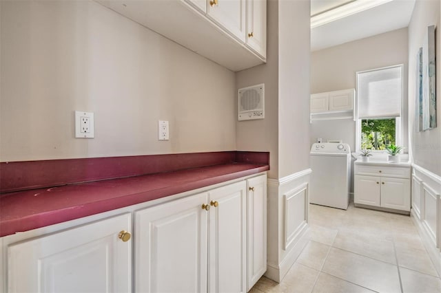 bathroom featuring tile patterned flooring and washer / dryer