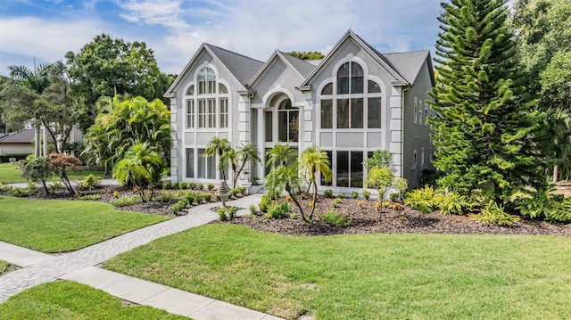 tudor house with a front yard