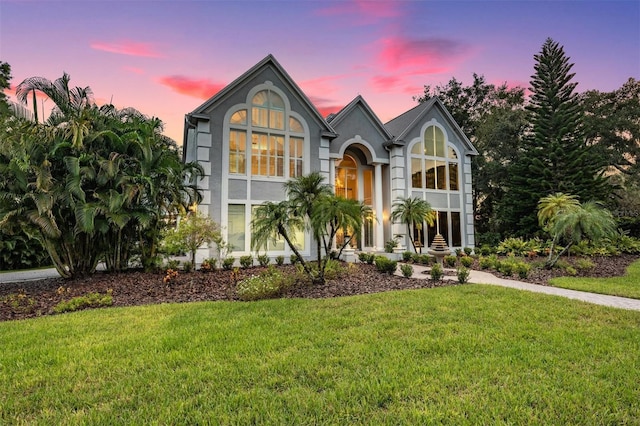 view of front of home with a lawn