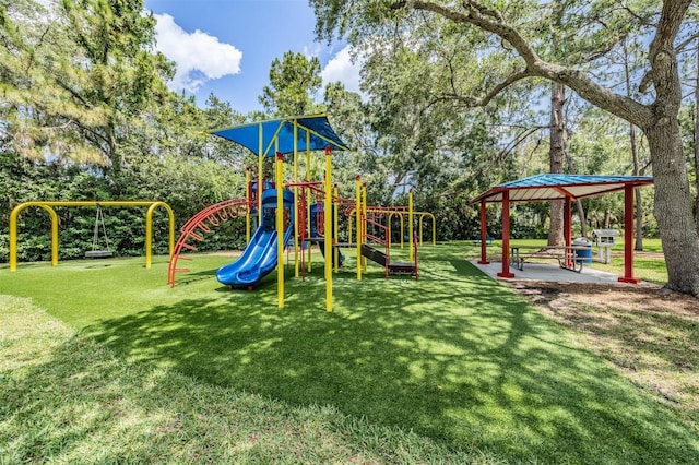 view of jungle gym featuring a lawn