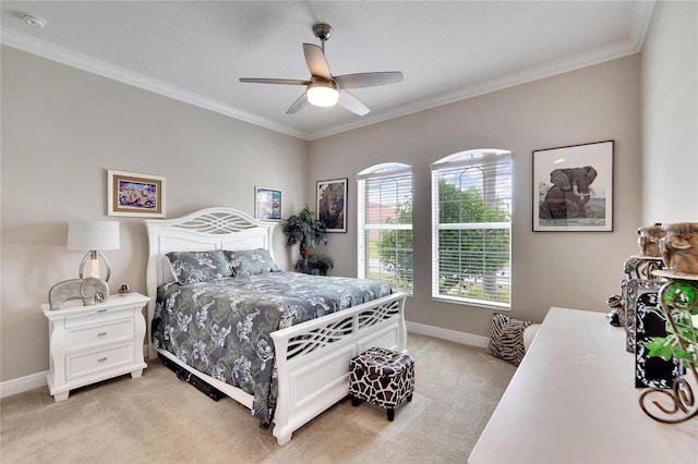 bedroom with crown molding, light colored carpet, and ceiling fan