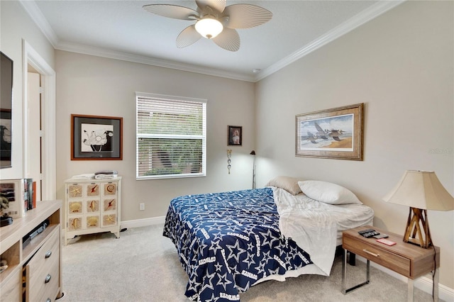 bedroom with baseboards, ceiling fan, crown molding, and light carpet