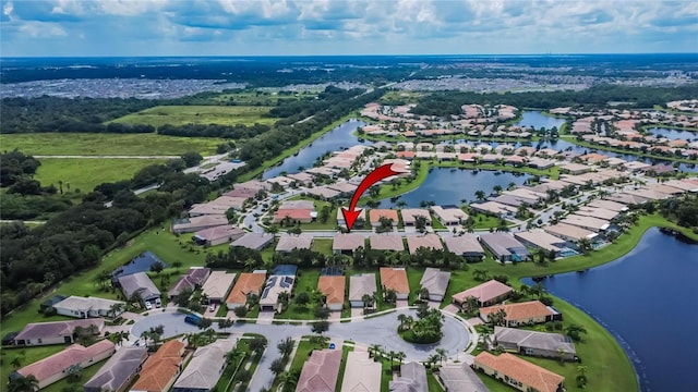 aerial view featuring a residential view and a water view