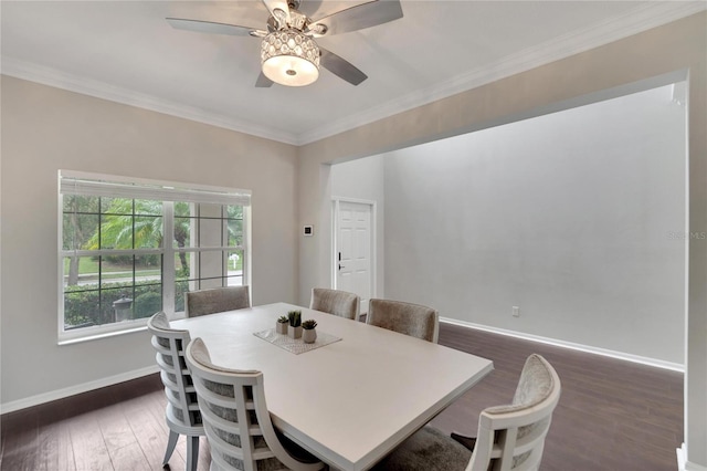 dining area with ornamental molding, ceiling fan, and dark hardwood / wood-style floors