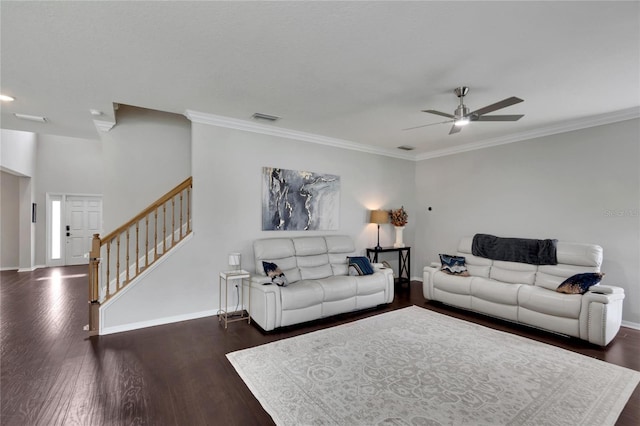 living room with crown molding, dark hardwood / wood-style flooring, and ceiling fan