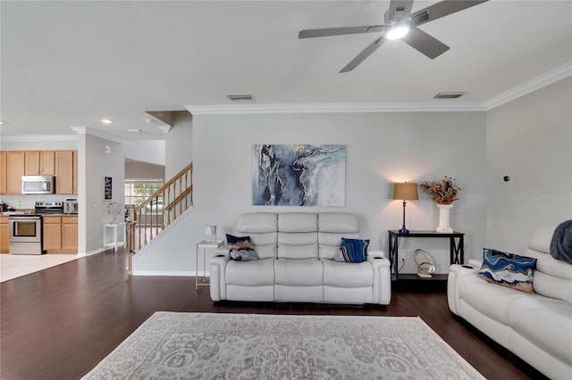 living room featuring ceiling fan, crown molding, and dark hardwood / wood-style flooring