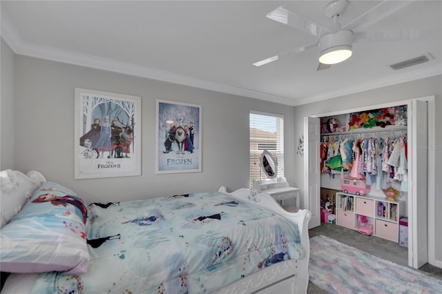 carpeted bedroom featuring a closet, ceiling fan, and crown molding