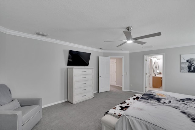 carpeted bedroom with a textured ceiling, ornamental molding, ceiling fan, and ensuite bathroom