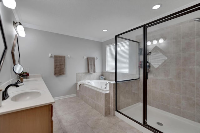 bathroom featuring plus walk in shower, tile patterned floors, vanity, and crown molding