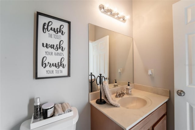 bathroom with vanity and toilet