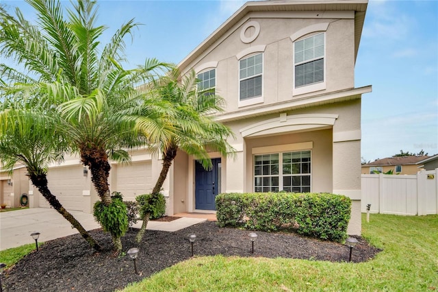 view of front of home featuring a front yard and a garage