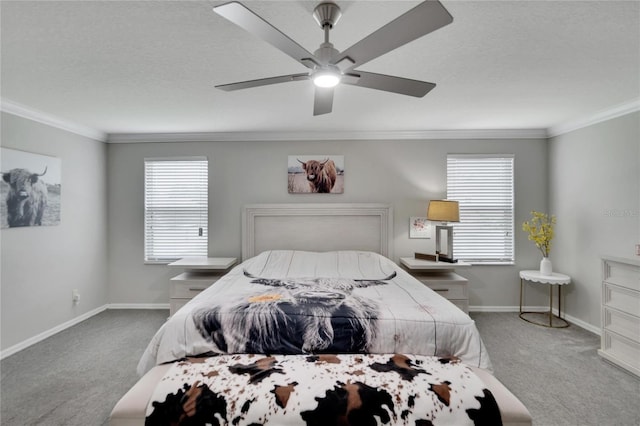 bedroom with a textured ceiling, ceiling fan, carpet floors, and crown molding