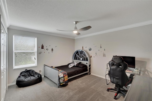 bedroom featuring a textured ceiling, carpet flooring, ornamental molding, and ceiling fan