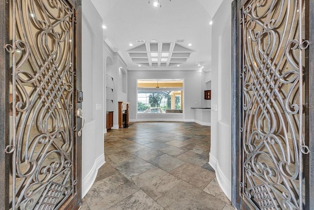 entryway with beamed ceiling and coffered ceiling