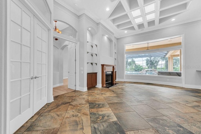 unfurnished living room featuring crown molding, coffered ceiling, and beam ceiling