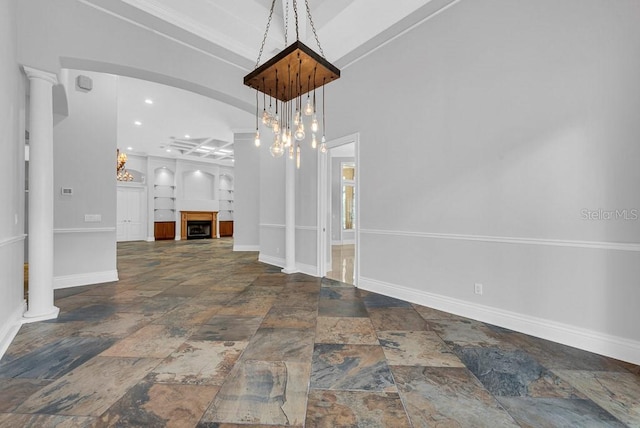 unfurnished dining area with decorative columns and ornamental molding