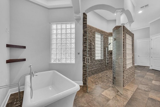 bathroom featuring shower with separate bathtub and crown molding