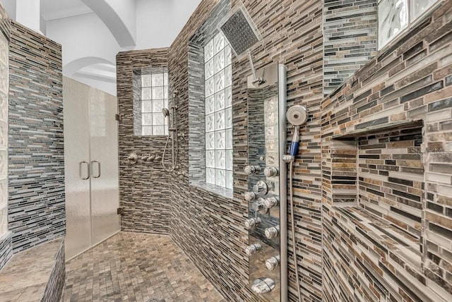 bathroom with tiled shower