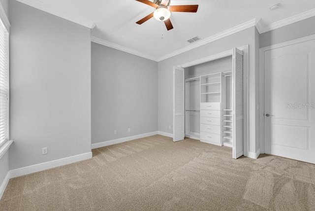 unfurnished bedroom with light carpet, ceiling fan, and crown molding