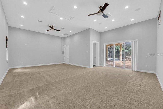 carpeted empty room featuring ceiling fan