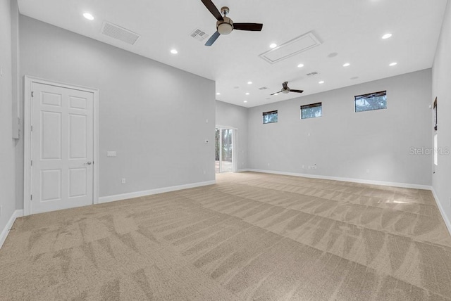 unfurnished room with light carpet and ceiling fan