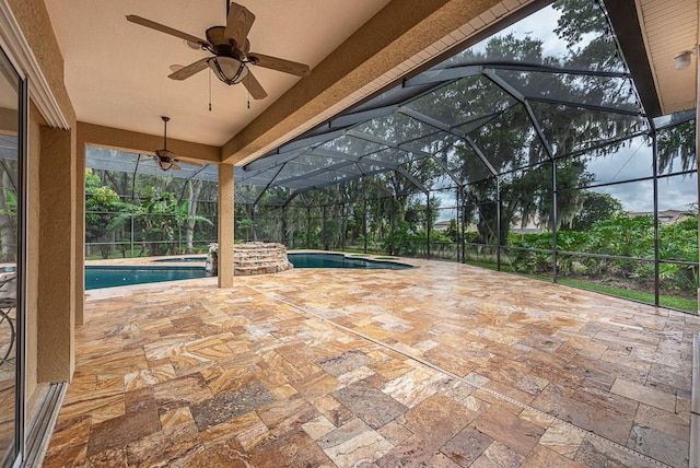 view of patio with glass enclosure, ceiling fan, and a swimming pool with hot tub