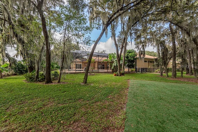 view of yard with a lanai