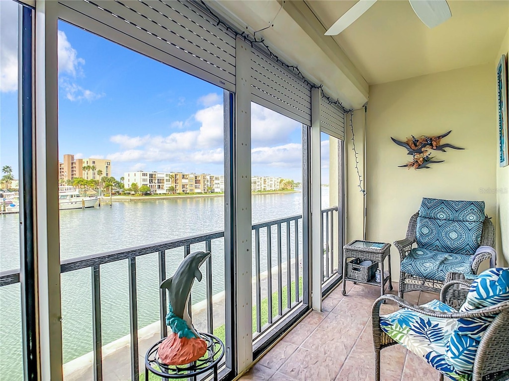 sunroom / solarium with a water view