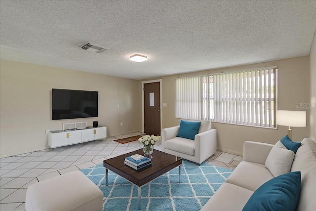 tiled living room with a textured ceiling