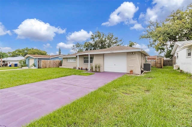 ranch-style house with a garage and a front lawn