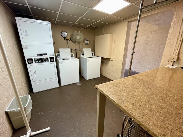 clothes washing area with stacked washer and dryer and washer and dryer