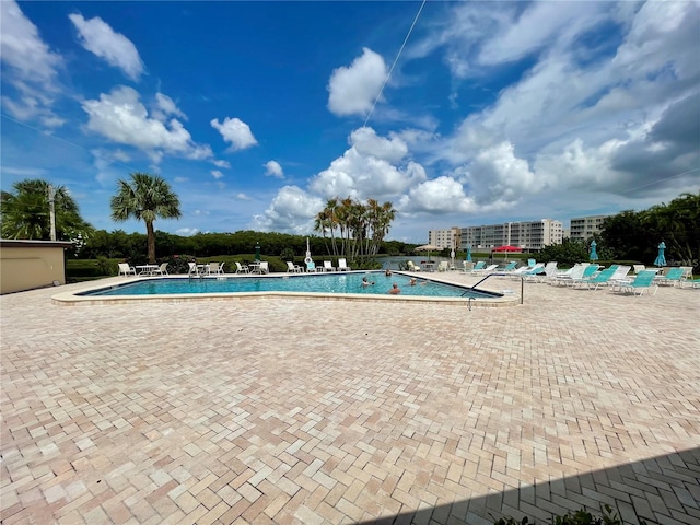 view of swimming pool featuring a patio