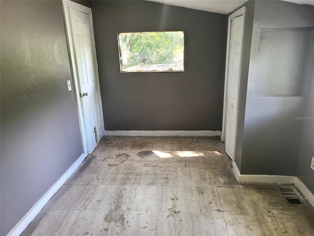 hallway with vaulted ceiling