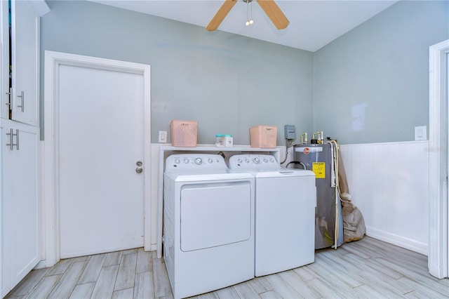 laundry room featuring light hardwood / wood-style flooring, ceiling fan, washing machine and dryer, and water heater