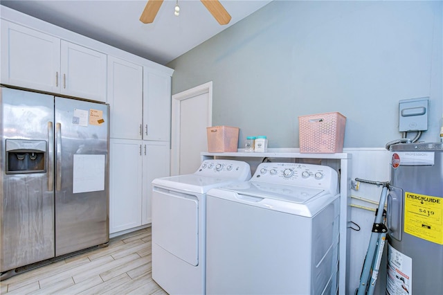 washroom featuring light hardwood / wood-style flooring, separate washer and dryer, ceiling fan, cabinets, and water heater