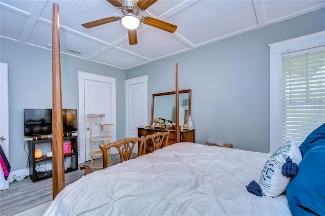 bedroom with hardwood / wood-style floors and ceiling fan